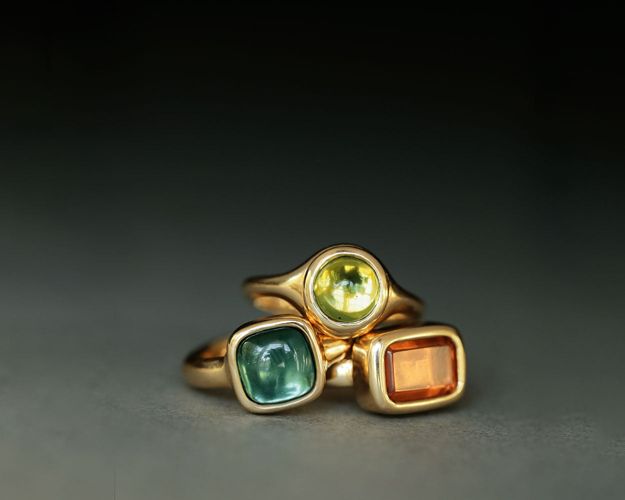 Three gemstone rings by George Rings Sophia Ring in blue green tourmaline Duchess ring in peridot and Empire ring in orange sapphire lost wax casting solid 18k gold