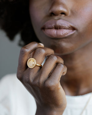 Black woman wearing Aurora Ring by George Rings solid 18k gold beaded round circle ring