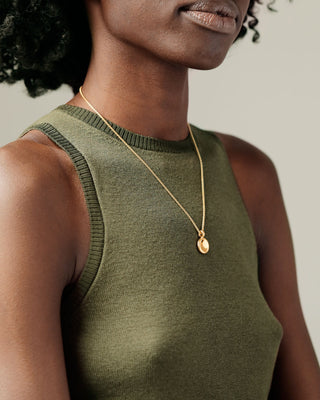 Woman wearing Button Grand pendant on round box chain by George Rings solid 18k gold circle charm pendant necklace