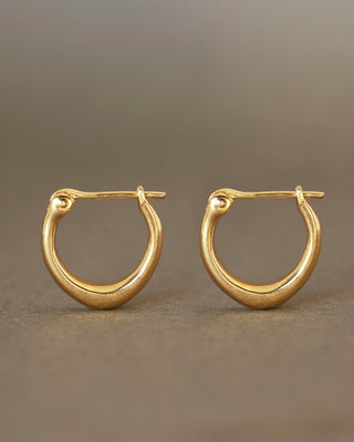 Pair of solid 18k yellow gold hoop earrings with a soft dome shape. Part of the George Rings Capitol Collection.