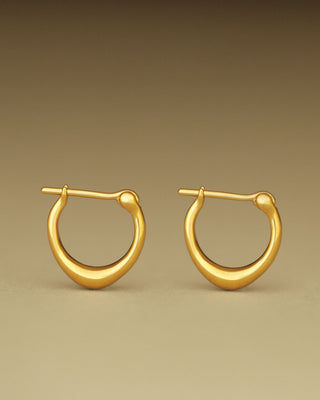 Pair of solid 18k yellow gold hoop earrings with a soft dome shape. Part of the George Rings Capitol Collection.