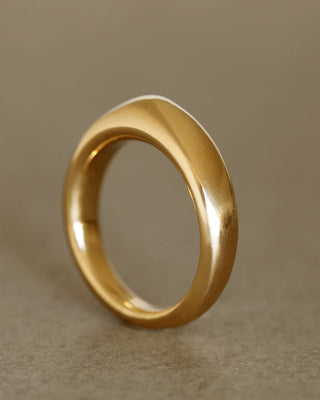Solid 18k yellow gold dome-shaped ring for weddings and milestones. Soft curves. Heavy.
