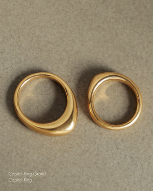 Two solid 18k yellow gold dome-shaped ring for weddings and milestones - one large dome and one smaller dome. Soft curves. Heavy. Not hollow.