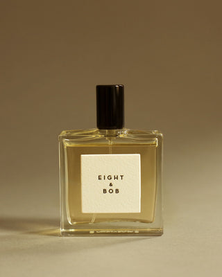 Glass bottle of Eight & Bob Original Perfume with George Rings
