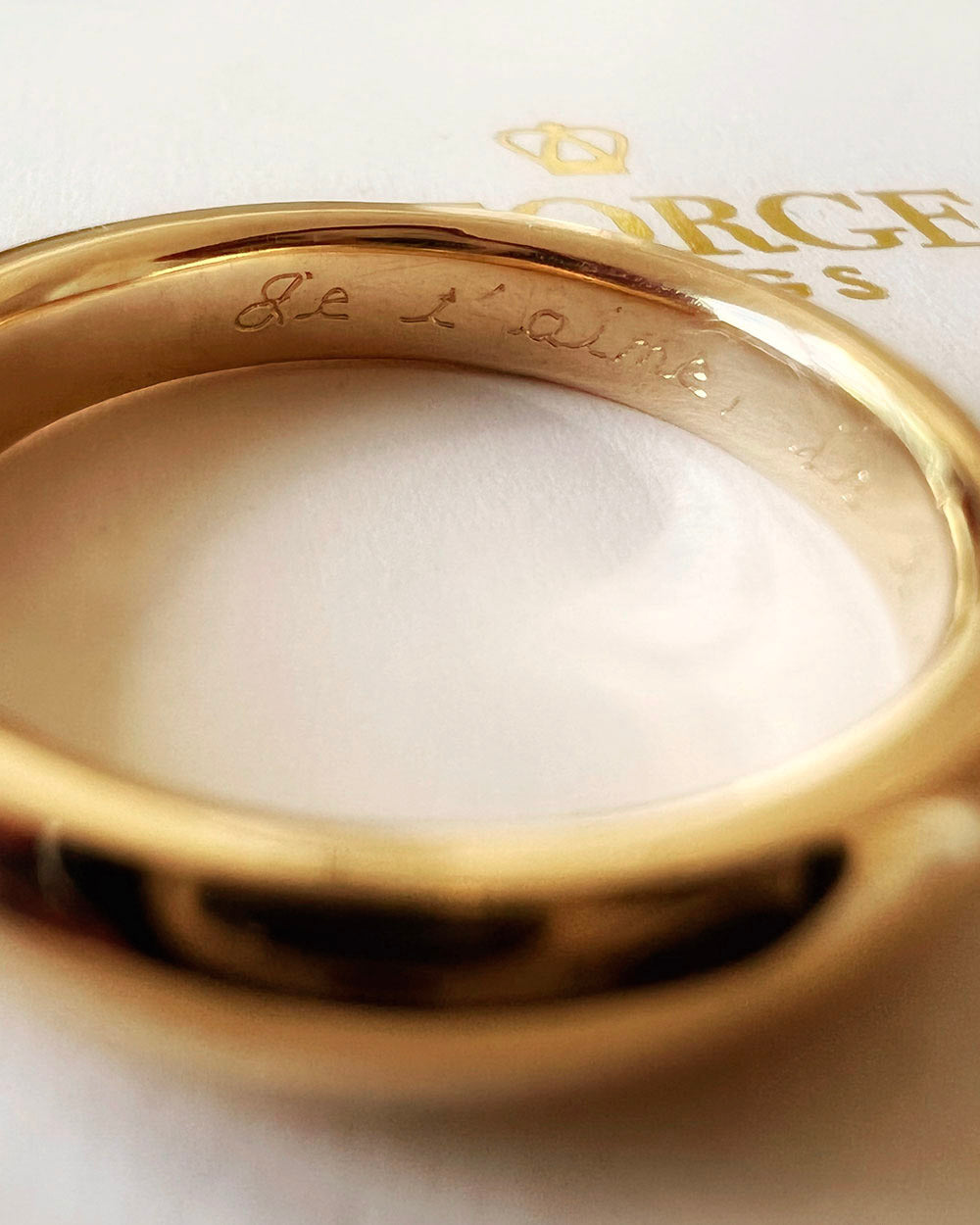 engraving script inside of gold wedding band by George Rings script font block font hand engraving