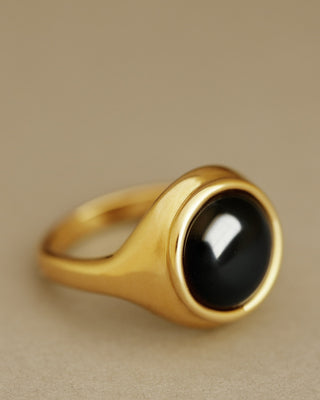 Large, round cabochon solitaire ring cast in solid 18k yellow gold. The Monarch in black onyx by George Rings.